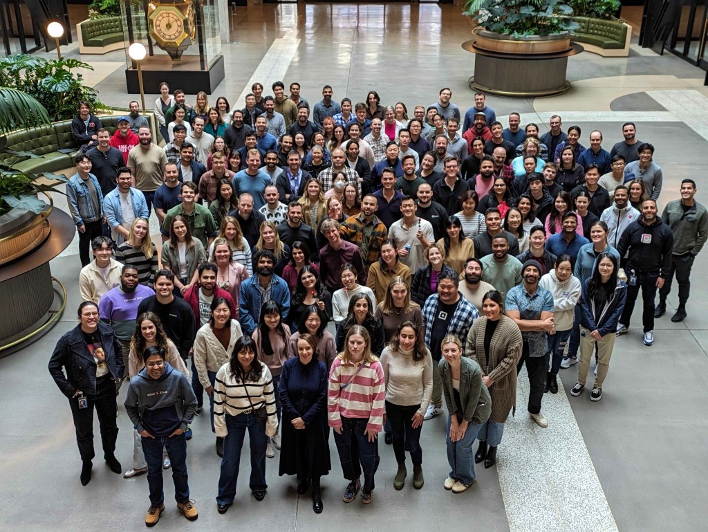 The Square Developers & Partners team — over a hundred people gathered in the atrium of Square's headquarters